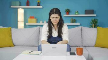 Woman closing laptop with angry expression. video