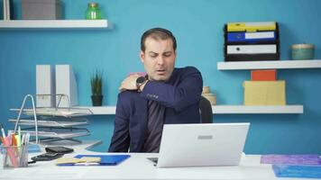 Businessman with aching shoulders is bored. video