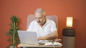 Concentrated man working on laptop. video