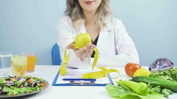 Fruit consumption for healthy life. The dietitian stretches the fruit. video