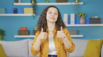 Young woman looking at camera making confidence sign. video