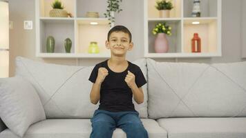 Boy experiencing joy looking at camera. video