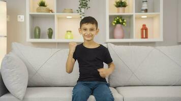 Cheerful boy dancing at home and feeling happy. video