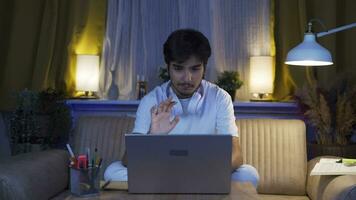 A student studying with a friend over video call.