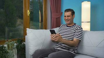Man texting with happy expression. video