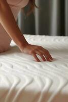 Woman touching soft orthopedic mattress. AI Generated photo