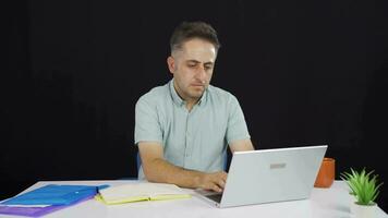 Negative expression of man using laptop. video