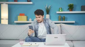 Man laughing at phone message. video