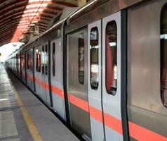 New Delhi India - August 10 2023 - Delhi Metro train arriving at Jhandewalan metro station in New Delhi, India, Asia, Public Metro departing from Jhandewalan station photo