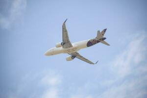 New Delhi, India, July 16 2023 - Vistara Airbus A320 neo take off from Indra Gandhi International Airport Delhi, Vistara domestic aeroplane flying in the blue sky during day time photo