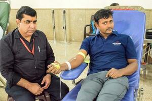 Delhi, India, July 19 2023 - Blood donor at Blood donation camp held at Balaji Temple, Vivek Vihar, Delhi, India, Image for World blood donor day on June 14 every year, Blood Donation Camp at Temple photo