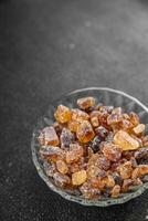 rock sugar crystals pieces candy brown sugar candied big rock caramel taste cane sugar healthy eating cooking appetizer meal food snack on the table photo