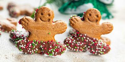 gingerbread man christmas cookie christmas sweet dessert holiday baking treat new year and celebration meal food snack on the table copy space food background photo