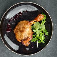 duck leg confit berry sauce poultry meat eating cooking meal food snack on the table copy space food background rustic top view photo