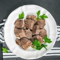 pork tongue cooked meat fresh delicious healthy eating cooking appetizer meal food snack on the table copy space food background rustic top view keto or paleo diet photo