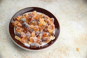 dessert rock sugar crystals pieces sweet candy brown sugar candied big rock caramel taste cane sugar cooking appetizer meal food snack on the table copy space food background rustic top view photo