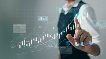 The analyst works on a laptop showing data business analysis and Data Management System with KPI for financial report and data analysis, business target and development. photo