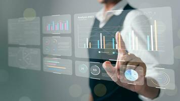 The analyst works on a laptop showing data business analysis and Data Management System with KPI for financial report and data analysis, business target and development. photo