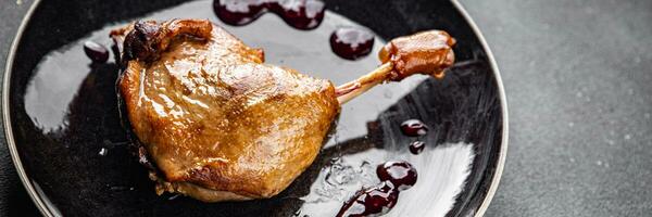 duck leg confit berry sauce poultry meat eating cooking meal food snack on the table copy space food background rustic top view photo