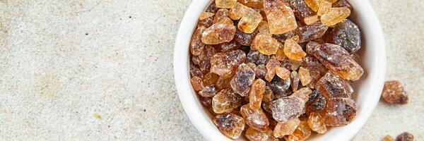 rock sugar crystals pieces candy brown sugar candied big rock caramel taste cane sugar healthy eating cooking appetizer meal food snack on the table photo