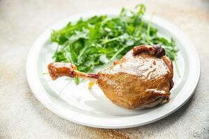 fresh duck leg confit berry sauce poultry meat eating cooking appetizer meal food snack on the table copy space food background rustic top view photo