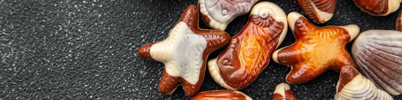 candy seashells delicious chocolate sweet dessert delicious healthy eating cooking appetizer meal food snack on the table photo