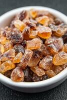 dessert rock sugar crystals pieces sweet candy brown sugar candied big rock caramel taste cane sugar cooking appetizer meal food snack on the table copy space food background rustic top view photo