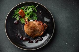 fresh duck leg confit berry sauce poultry meat eating cooking appetizer meal food snack on the table copy space food background rustic top view photo