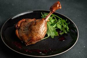 fresh duck leg confit berry sauce poultry meat eating cooking appetizer meal food snack on the table copy space food background rustic top view photo