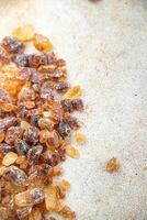 rock sugar crystals pieces candy brown sugar candied big rock caramel taste cane sugar healthy eating cooking appetizer meal food snack on the table photo