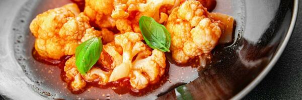 cauliflower tomato sauce stewed vegetable eating cooking appetizer meal food snack on the table photo