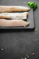 fish fish fillet blue whiting fresh seafood eating cooking appetizer meal food snack on the table copy space food background rustic top view photo