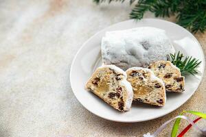 stollen christmas sweet dessert holiday baking treat new year and christmas celebration meal food snack on the table photo