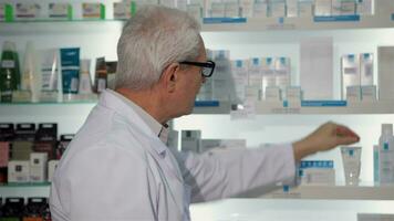 Male pharmacist posing at the drugstore video