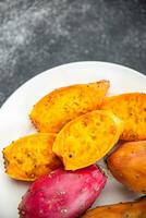 prickly pear exotic fresh fruit figues de barbarie tasty appetizer meal food snack on the table photo