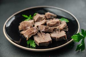 pork tongue cooked meat fresh delicious healthy eating cooking appetizer meal food snack on the table copy space food background rustic top view keto or paleo diet photo