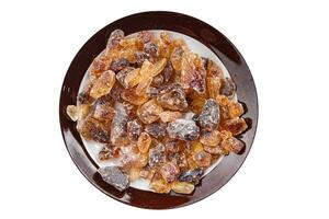 rock sugar crystals pieces candy brown sugar candied big rock caramel taste cane sugar healthy eating cooking appetizer meal food snack on the table photo