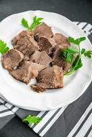 pork tongue cooked meat fresh delicious healthy eating cooking appetizer meal food snack on the table copy space food background rustic top view keto or paleo diet photo