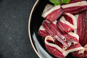 dried duck breast magret smoked jerky cured dried meat fresh delicious eating cooking appetizer meal food snack on the table copy space photo