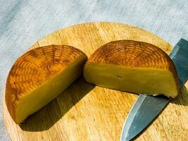 Cheese on a wooden board. Background. Georgian cheese suluguni photo