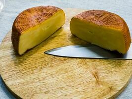 Cheese on a wooden board. Background. Georgian cheese suluguni photo