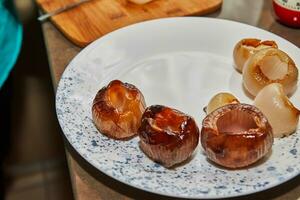 Place the prepare shallots for the filling on a plate. French gourmet food photo