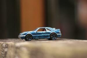 MAGELANG,INDONESIA.12 05 2023.photo of a car race toy car with a blurred background. photo