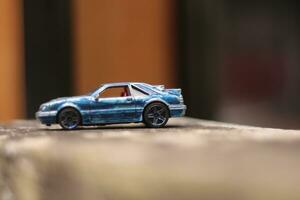 MAGELANG,INDONESIA.12 05 2023.photo of a car race toy car with a blurred background. photo