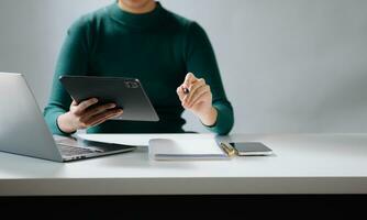 businesswoman hand working with new modern computer using on smartphone and tablet as concept photo