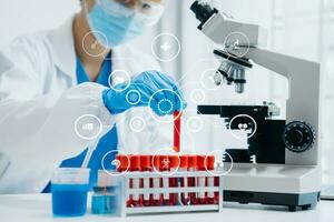 DNA molecule testing concepts. The doctor in a mask examines DNA molecules on the chemical laboratory with virtual icon photo