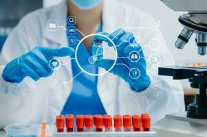 DNA molecule testing concepts. The doctor in a mask examines DNA molecules on the chemical laboratory with virtual icon photo