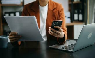 businesswoman hand working with new modern computer using on smartphone and tablet as concept photo