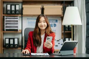 Portrait of female office businesswoman startup daydreaming about her work, startup and working with laptop on office desk in office photo