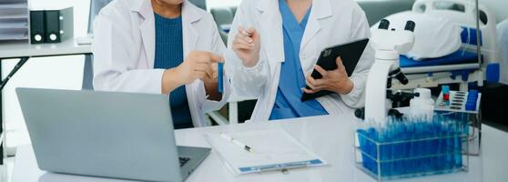 Dctor work on digital tablet healthcare doctor technology tablet using computer in laboratory study with virtual icon photo